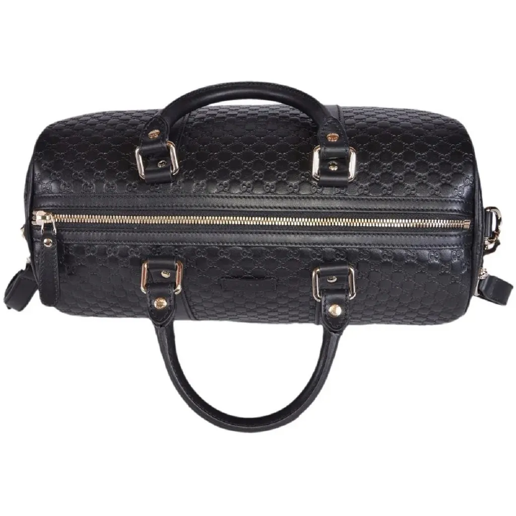 Gucci Microguccissima GG Boston Bag Black Embossed Leather Gold Hardware Black Leather Never worn - Model View