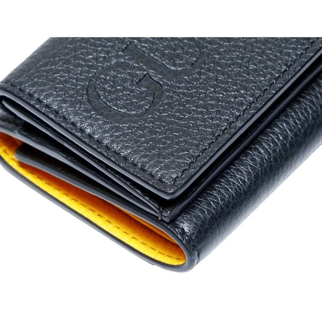 Gucci Embossed Logo Mini Tri-Fold Wallet Black Yellow Pebbled Leather Black Leather Never worn - Model View
