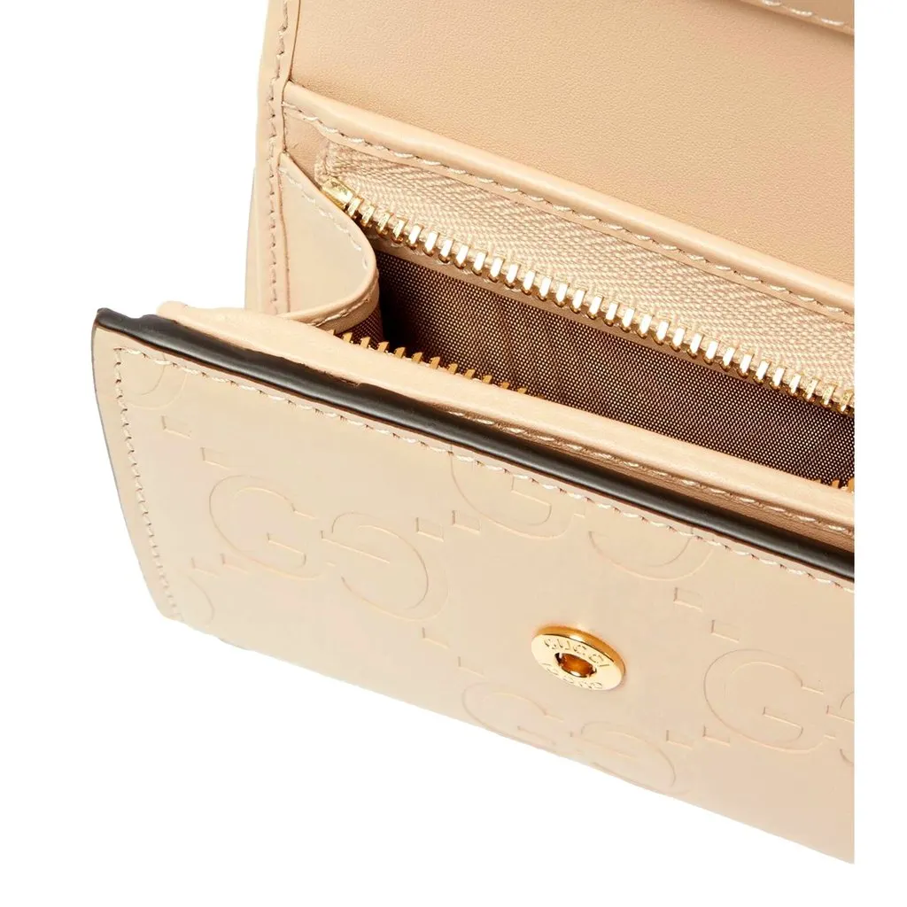 Gucci Gilbert GG Embossed Calf Leather Beige Trifold Wallet Gold Logo White Leather Never worn - Inside View