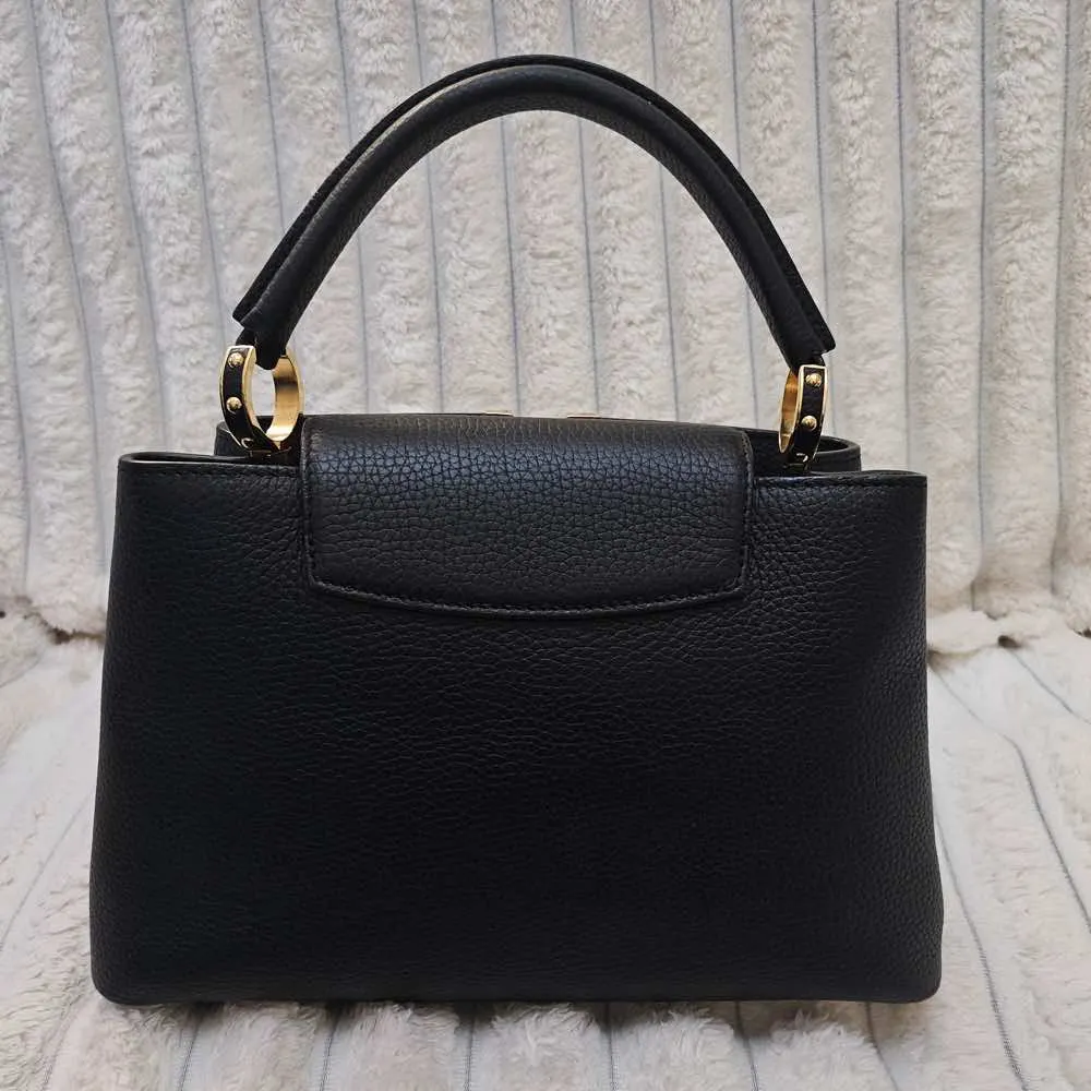 Louis Vuitton PM Capucines Black Leather Gold Good - Model View