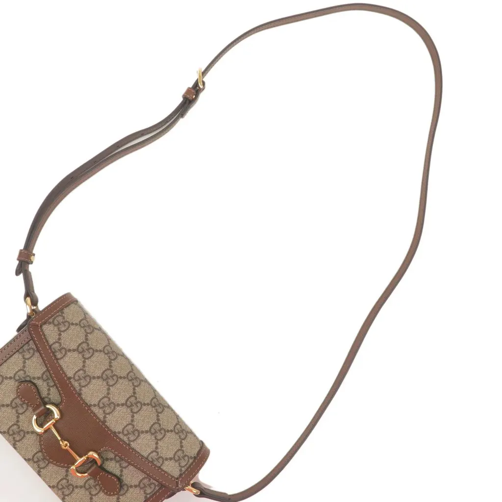 Gucci Beige/Brown GG Supreme Canvas Mini Horsebit 1955 Crossbody Bag Beige Canvas Never worn - Model View