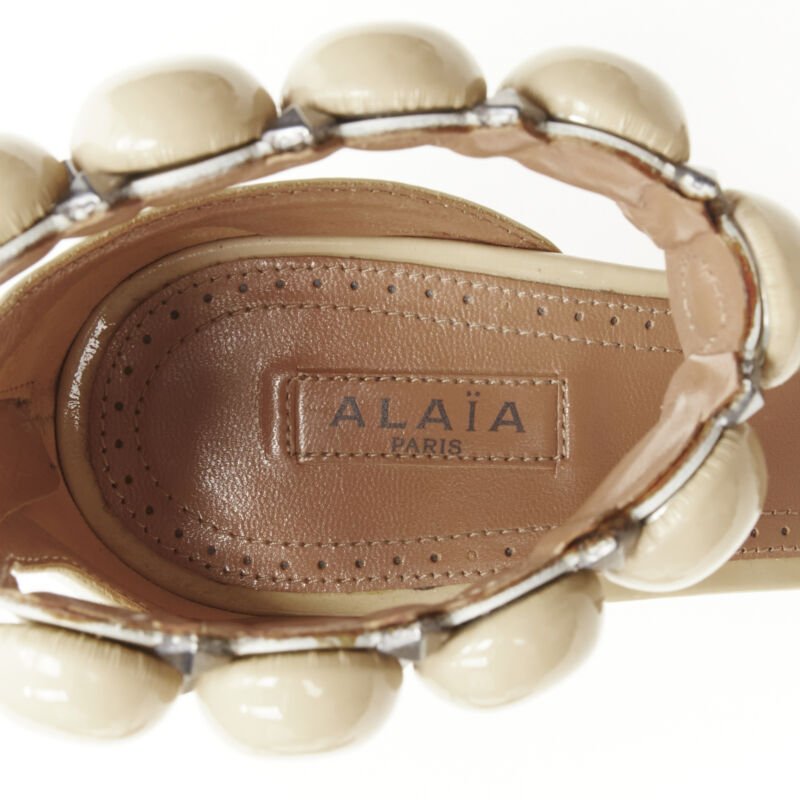 Alaïa Studded Patent Sandals - Image 12
