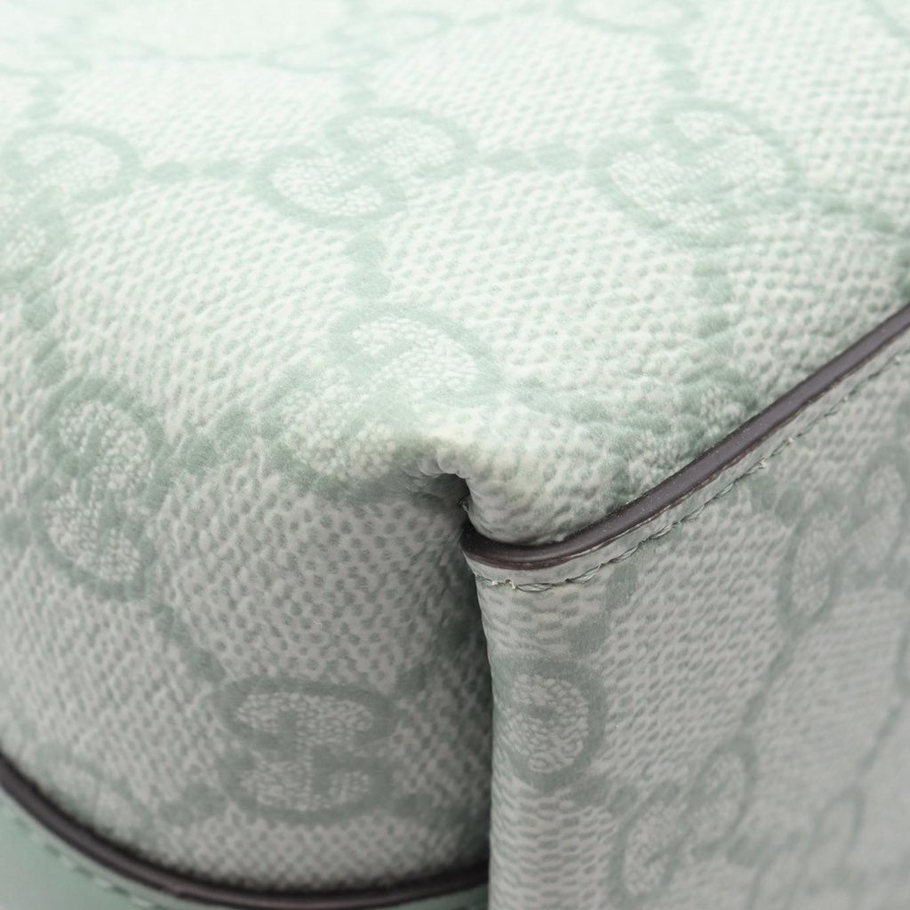 Gucci Small GG Supreme Emblem Bucket Bag - Side view