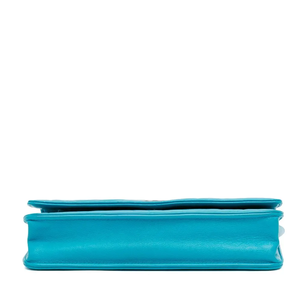 Chanel Lambskin Camellia Embossed Wallet On Chain Blue Leather Good - Model View