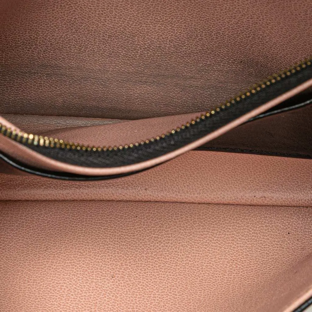 Louis Vuitton Monogram Embossed Pochette Coussin Black Leather Good - Model View
