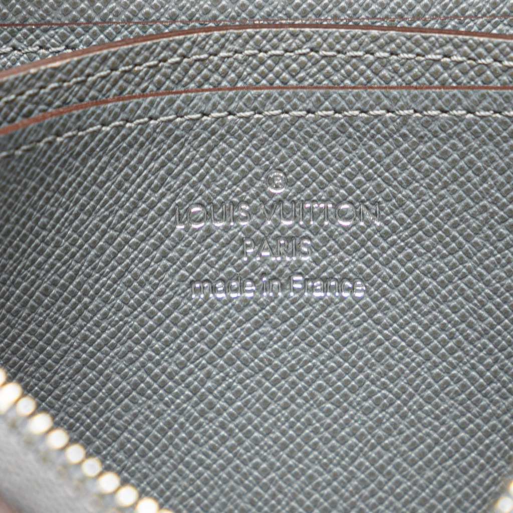 Louis Vuitton Taiga Zippy Vertical Coin Purse - Side view