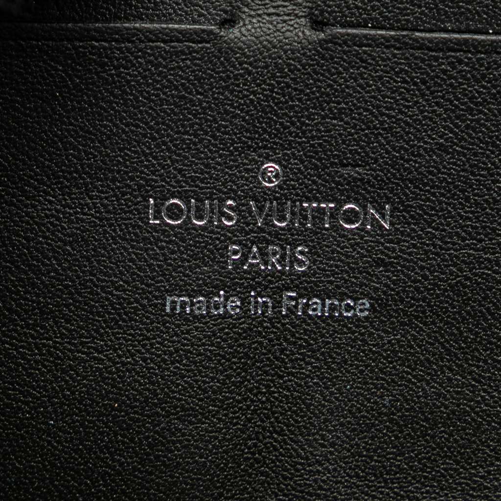 Louis Vuitton Monogram Taurillon Soft Trunk Wallet - Side view