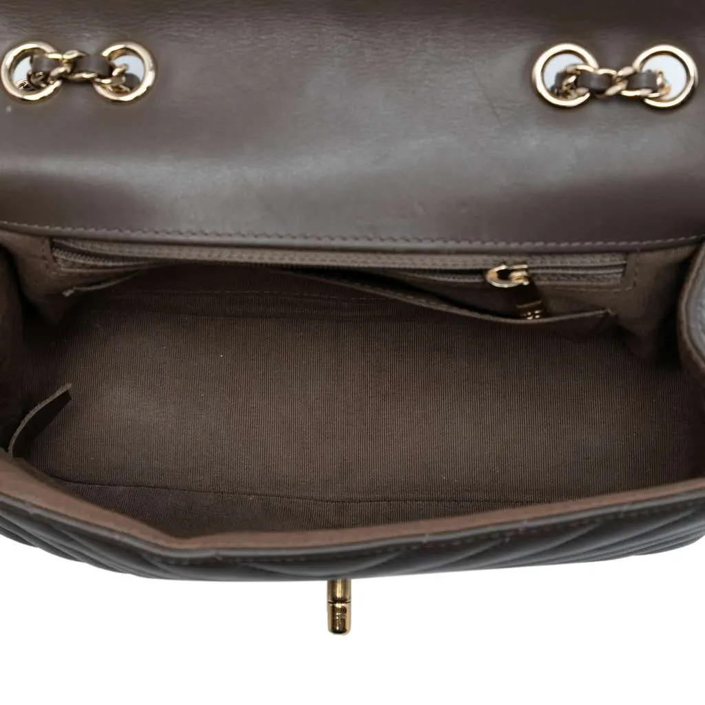 Chanel Small Chevron Lambskin Statement Flap Brown Leather Good - Model View