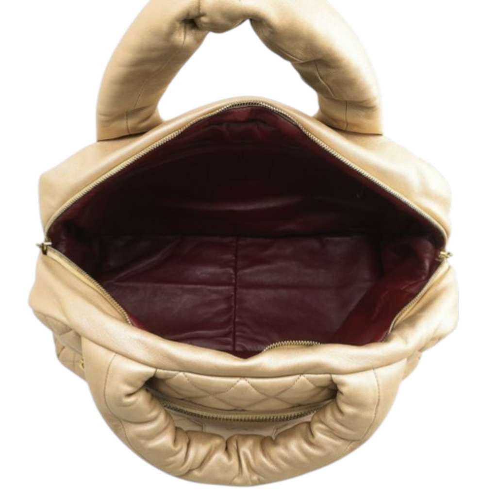 Chanel Quilted Metallic Lambskin Coco Cocoon Bowler Bag Gold Leather Good condition - Model View