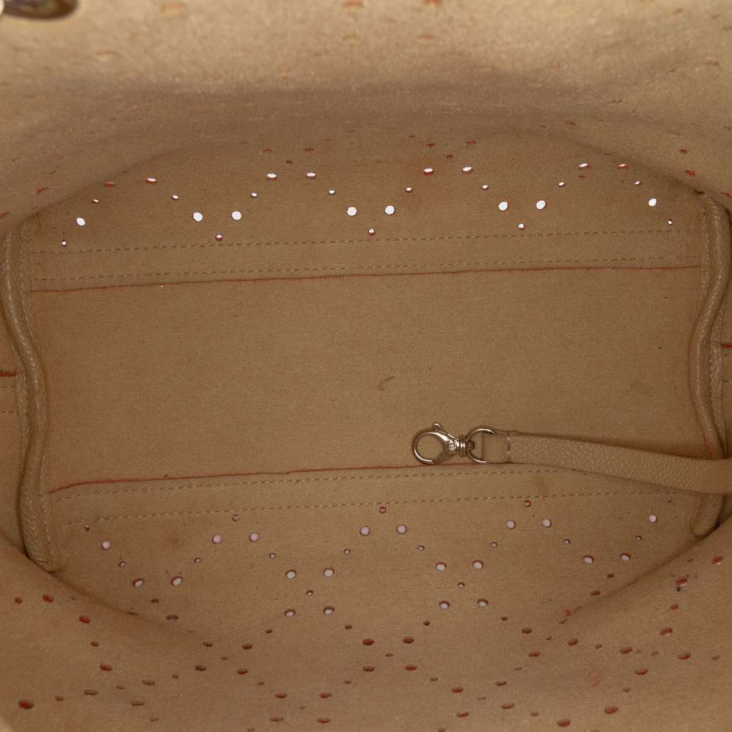 Chanel Medium CC Perforated Caviar Drawstring Bucket Bag Orange Leather Good condition - Model View