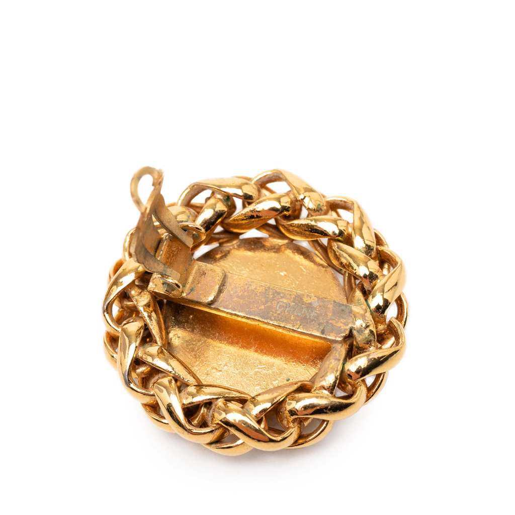 Chanel CC Gold Plated Wheat Medallion Clip On Earrings Gold Metal Good condition - Model View