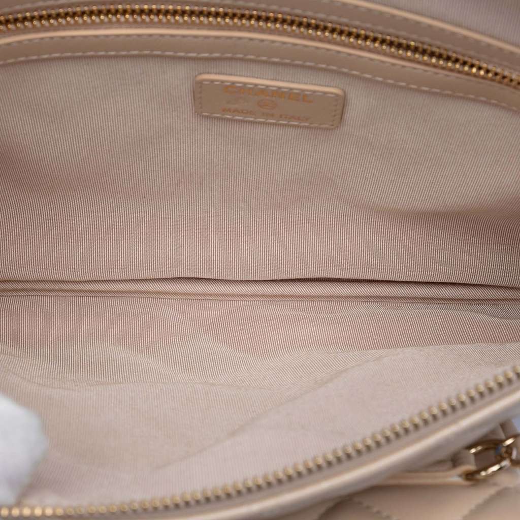 Chanel CC Iridescent Quilted Lambskin Pouch with Mini Flap Purse Beige Leather Good condition - Model View