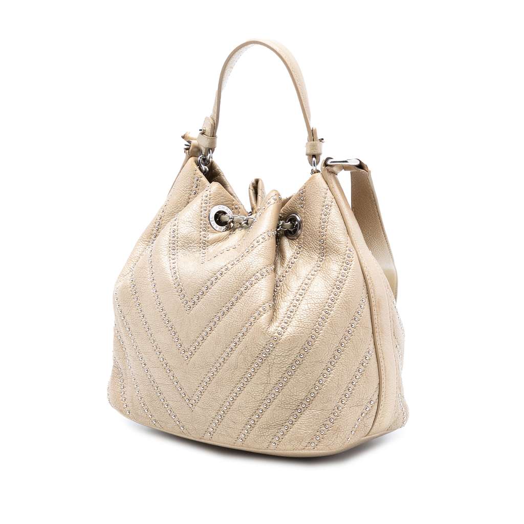 Chanel Small Chevron Calfskin Stud Wars Drawstring Bucket Bag Beige Leather Good condition - Back View