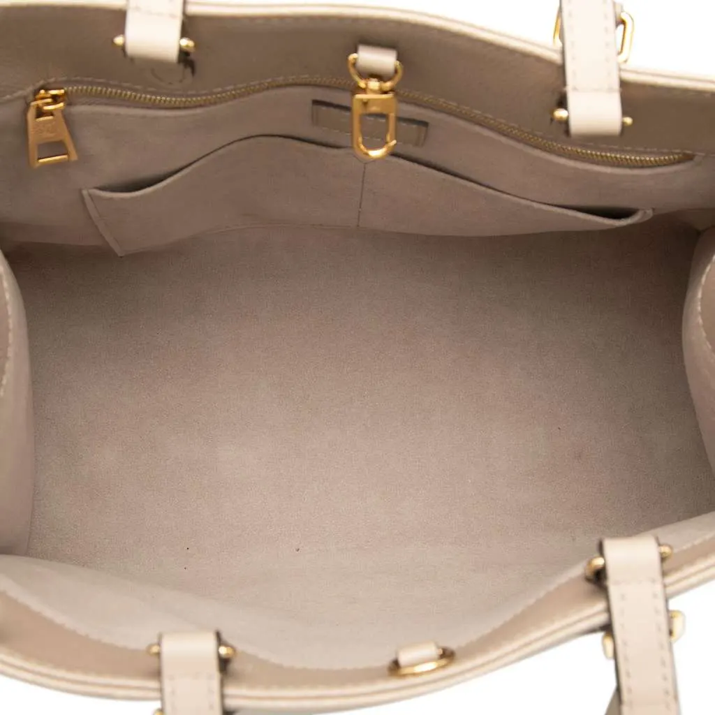 Louis Vuitton Monogram Empreinte OnTheGo MM Beige Leather Very good - Model View