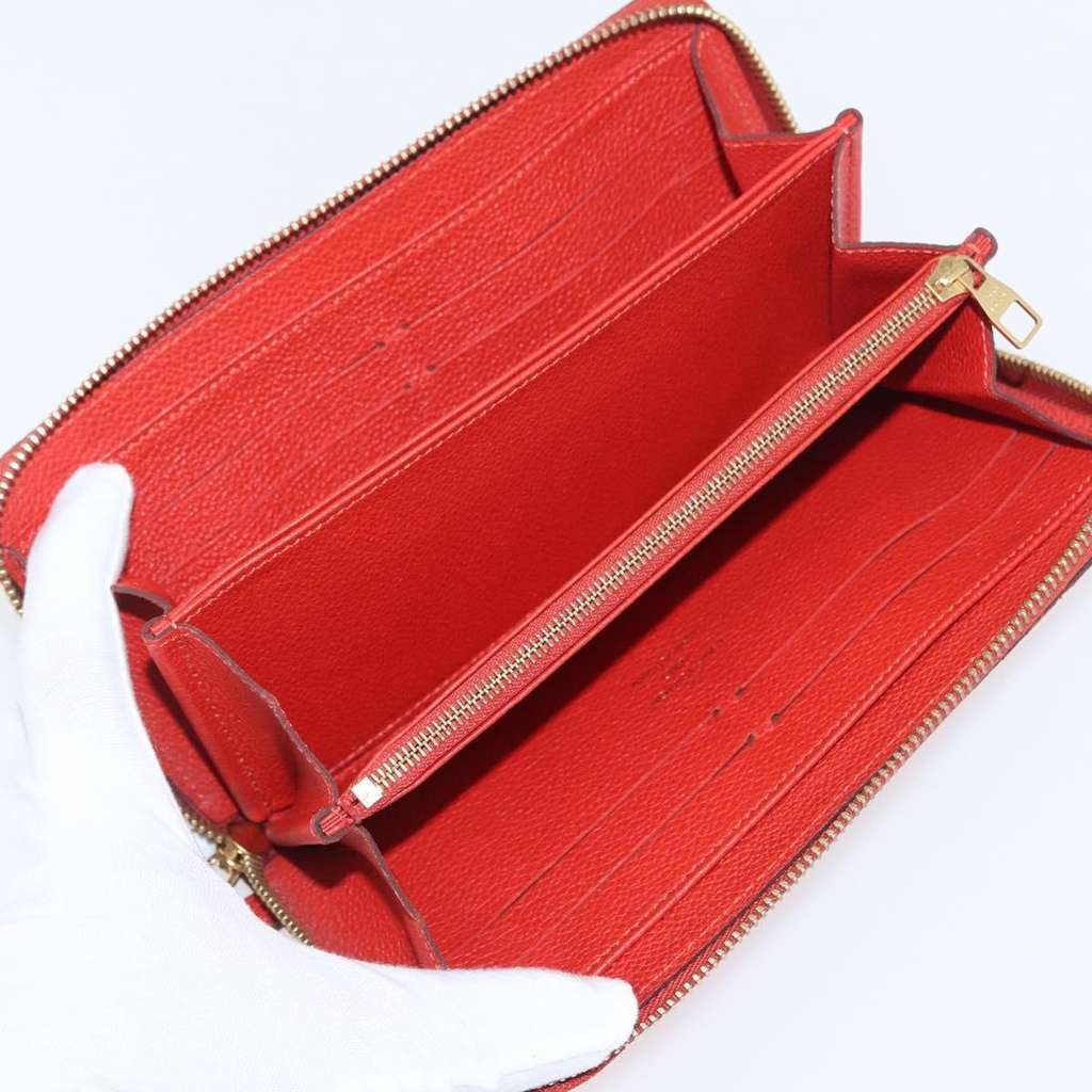 Louis Vuitton Portefeuille zippy Monogramme Empreinte Orange Leather Good condition - Box View