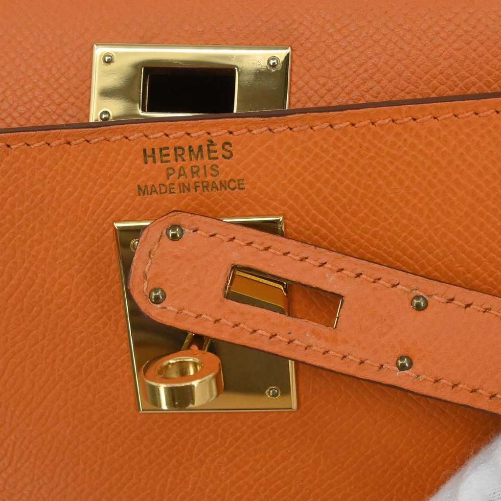 Hermès Kelly Handbag Orange Leather Never worn - Model View